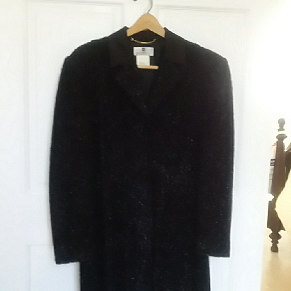 GIVENCHY.  BLACK SHOT THRU LOOKS LIKE SILVER